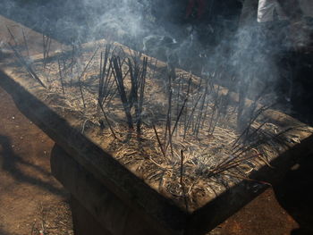 High angle view of burning incenses at temple