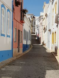 Alley amidst buildings in city