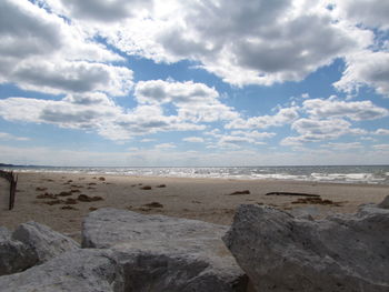 Scenic view of sea against cloudy sky