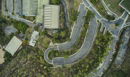 Aerial view of parking lot with many cars from above, transportation and urban concept