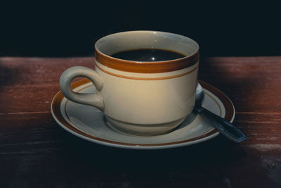 Close-up of coffee cup on table