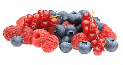 Close-up of fruits against white background