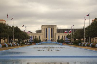 Fountain against historic building 