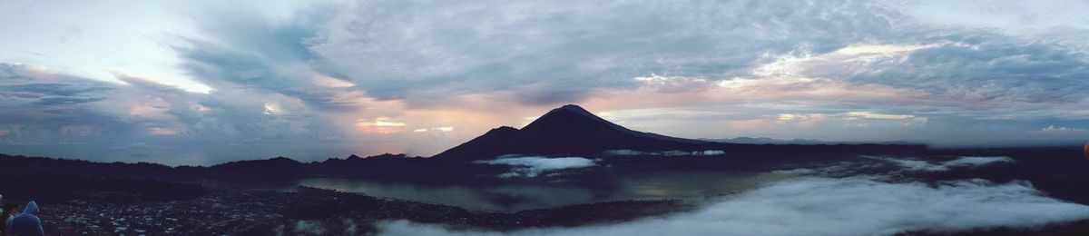 Scenic view of silhouette mountains against sky during sunset