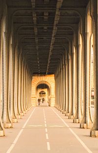 Long walkway below bridge