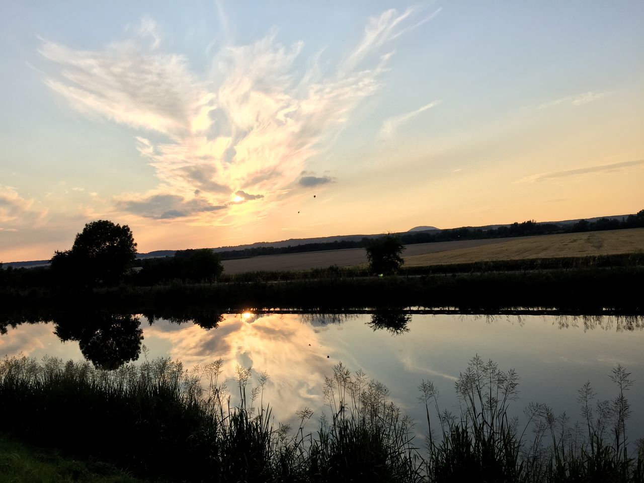 tranquil scene, tranquility, sunset, reflection, water, scenics, lake, beauty in nature, sky, tree, nature, silhouette, landscape, idyllic, cloud - sky, river, cloud, non-urban scene, orange color, countryside