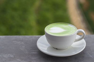 Close-up of coffee cup on table