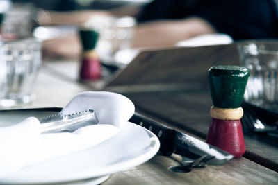 Close-up of wine glasses on table