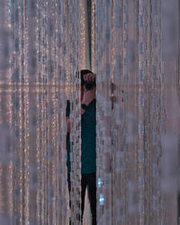 Digital composite image of woman standing in water