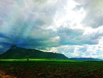 Scenic view of landscape against cloudy sky