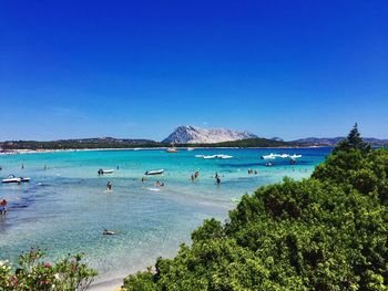 Scenic view of sea against clear blue sky