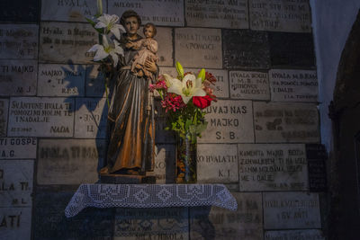 Statue of text on stone wall