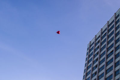 Low angle view of building against clear blue sky