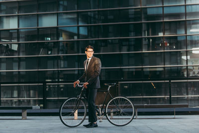 Man riding bicycle in city