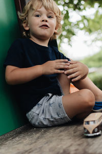Young boy playing with the toys 