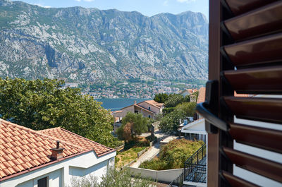 High angle view of townscape by mountain