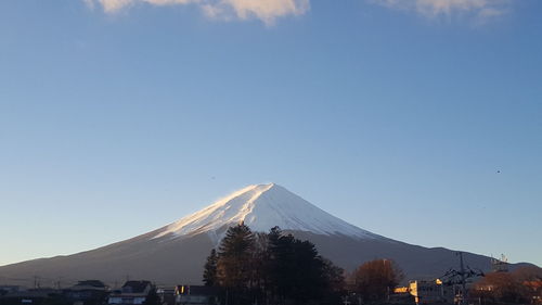 Scenic view of mountains against clear blue sky