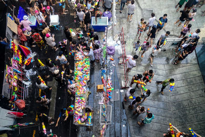 High angle view of crowd at street market during songkran festival