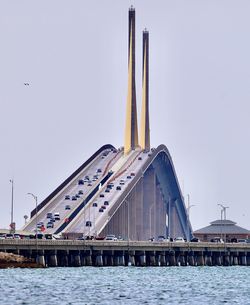 Bridge over river against clear sky