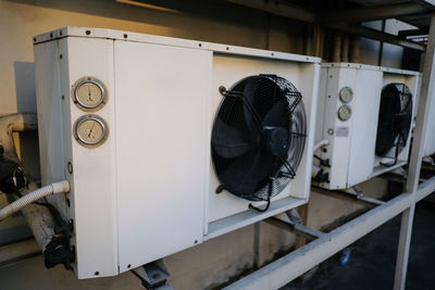 View of air conditioners against wall