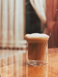 Close-up of coffee in glass on table