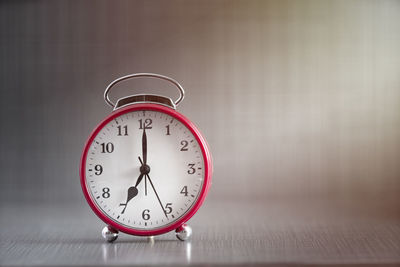 Close-up of clock on table