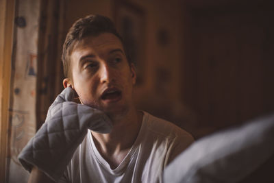 Portrait of young man looking at camera