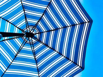 Low angle view of skylight against clear blue sky