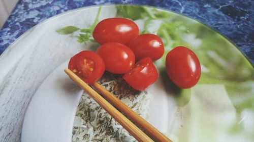 High angle view of tomatoes in plate on table