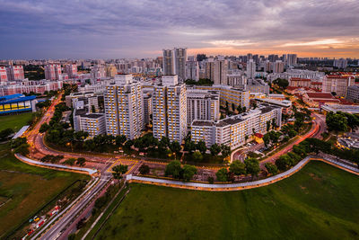 High angle view of illuminated buildings against sky
