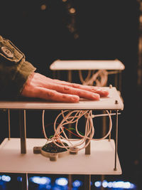 Close-up of hand using laptop on table