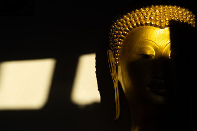 Close-up of statue of buddha in building