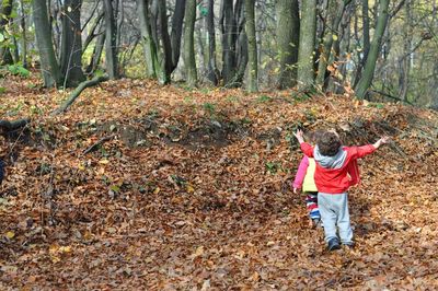 Girl standing in forest