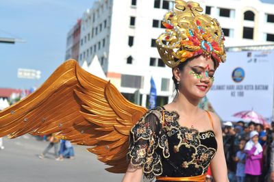 Portrait of young woman standing outdoors