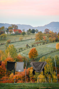 Laundry on clothesline by autumn hill