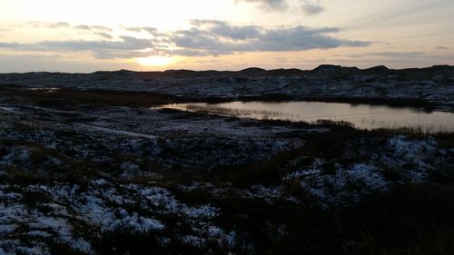 Scenic view of landscape against sky during sunset