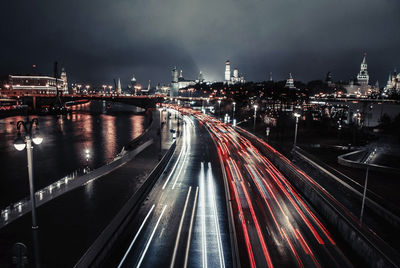 High angle view of light trails on road at night