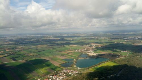 Aerial view of agricultural landscape against sky