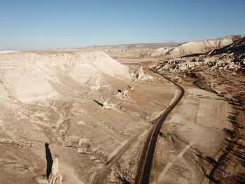 Panoramic view of desert against clear sky