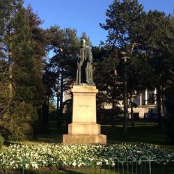 Statue of woman in park