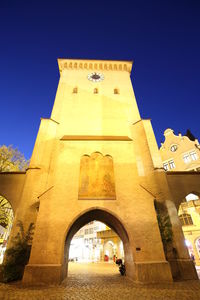 Low angle view of built structure against clear blue sky