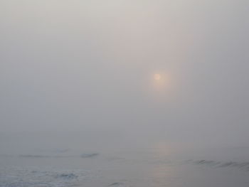 Scenic view of sea against sky at sunset