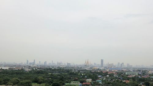 Modern buildings in city against sky