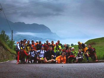 People on road against mountain range