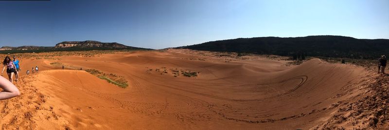 Panoramic view of desert against clear sky