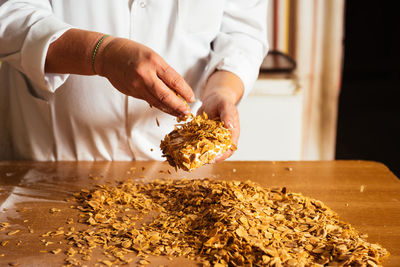 Midsection of person preparing food