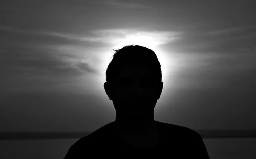 Portrait of silhouette man standing against sky during sunset