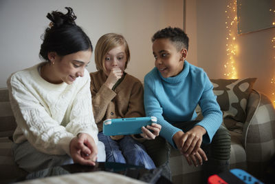 Children playing video games at home