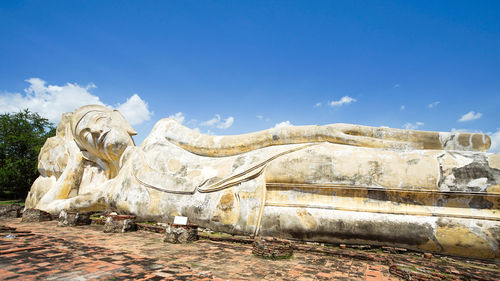 Statue against blue sky