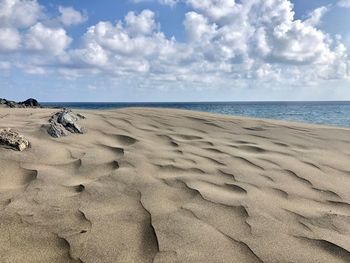 Scenic view of beach against sky